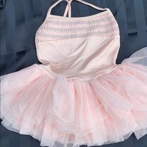 Pink leotard with attached full tulle skirt